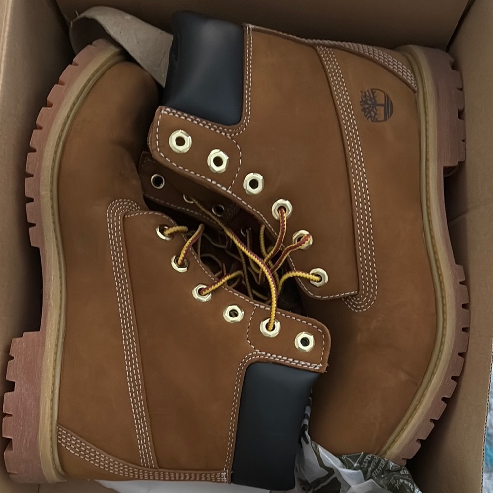 Timberland Brown and Black High-Top Boots with Durable Leather